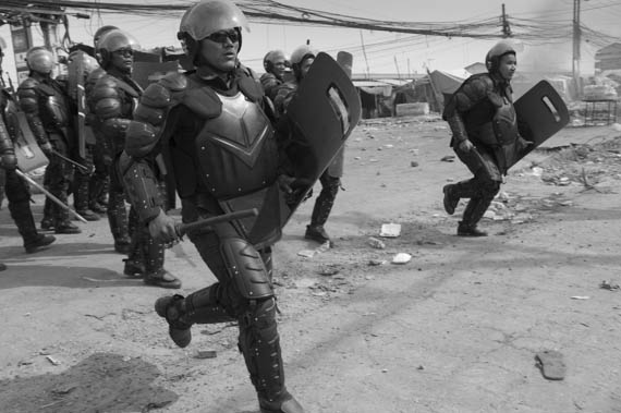 CAMBODIA. Phnom Penh.3/01/2014: Armed forces confronting striking workers who pulled up barricades on Veng Sreng road will leave behind at least 3 dead, one badly injured and 3 confirmed arrests.