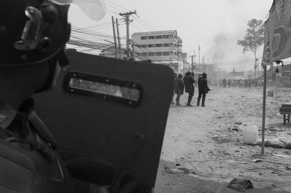 CAMBODIA. Phnom Penh.3/01/2014: Armed forces confronting striking workers who pulled up barricades on Veng Sreng road will leave behind at least 3 dead, one badly injured and 3 confirmed arrests.