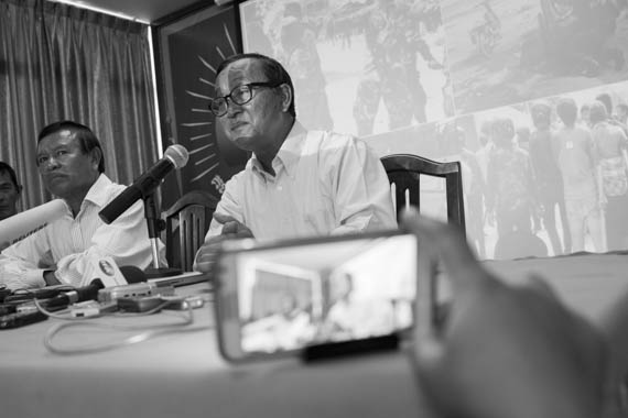 CAMBODIA. Phnom Penh. 7/01/2014: Kem Sokha and Sam Rainsy, CNRP co-Presidents, at a press conference at the opposition CNRP headquarters announcing a complaint will be lodged against the Cambodian government at the ICC regarding the cracdkown and subsequent killing of striking workers on January 3rd.