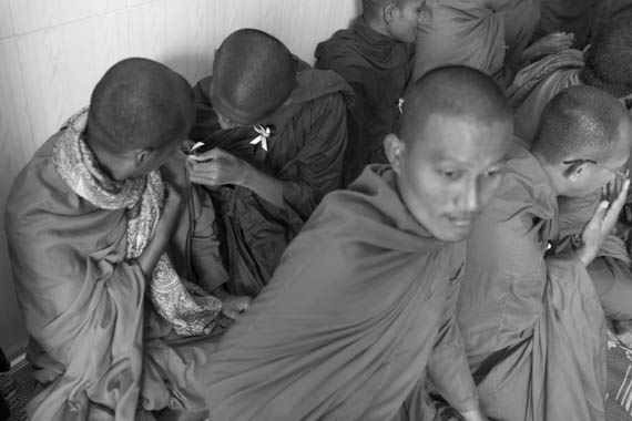 CAMBODIA. Phnom Penh. 10/01/2014: Buddhist monks wearing a mourning ribbon at a ceremony for the crackdown victims, followed by a press conference at Solidarity House requesting the release of the 23 arrested during the latest crackdown on striking factory workers, a halt to violence and a salary rise to 160$.