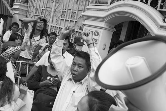 CAMBODIA. Phnom Penh. 13/01/2014: CCADWU leader demonstrating with some 80 workers' unions representatives, monks and activists gathered in front of the UNHCHR to deliver a petition requesting the liberation of 23 workers, activists and union leaders who were arrested during the violent crackdowns on striking workers of January 2nd and 3rd.