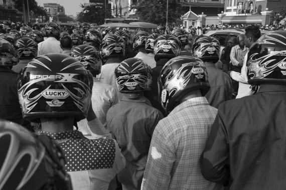 CAMBODIA. Phnom Penh. 14/01/2014: Helmeted thugs hired by the Municipality to keep order while Sam Rainsy and Kem Sokha, opposition CNRP co-Presidents, and Rong Chhun, Leader of the Independent Teachers Association, are summonsed at the Phnom Penh Municipal Court, to answer questions about their alleged incitement to violence during the weeks-long workers srike.