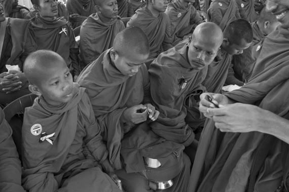 CAMBODIA. Phnom Penh. 16/01/2014: Second day in a ceremony organised by the Boeung Kak lake community with over 200 monks to commemorate 4 garment workers who were killed during the violent military crackdown of January 3rd on striking workers.