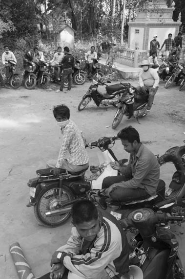 CAMBODIA. Treuy Sla (Kandal). 21/01/2014: CPP sympathisers, mostly from outside the commune, and riot police occupy the grounds, forcing the opposition CNRP to cancel a planned gathering with Sam Rainsy and Kem Sokha, CNRP co-presidents, and villagers.