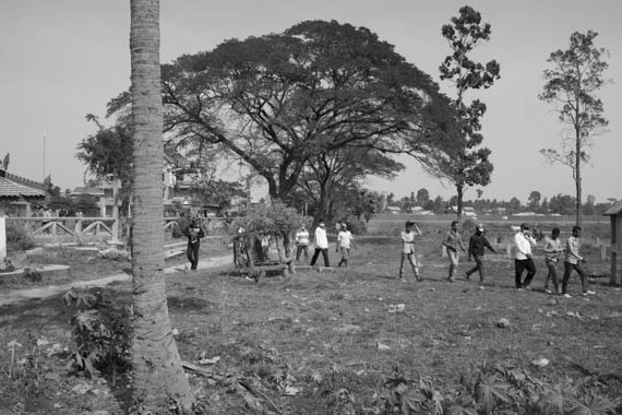 CAMBODIA. Treuy Sla (Kandal). 21/01/2014: CPP sympathisers, mostly from outside the commune, and riot police occupy the grounds, forcing the opposition CNRP to cancel a planned gathering with Sam Rainsy and Kem Sokha, CNRP co-presidents, and villagers.