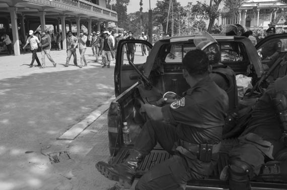 CAMBODIA. Treuy Sla (Kandal). 21/01/2014: CPP sympathisers, mostly from outside the commune, and riot police occupy the grounds, forcing the opposition CNRP to cancel a planned gathering with Sam Rainsy and Kem Sokha, CNRP co-presidents, and villagers.