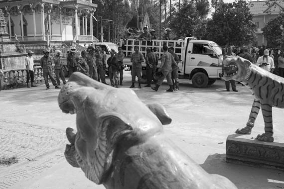 CAMBODIA. Treuy Sla (Kandal). 21/01/2014: CPP sympathisers, mostly from outside the commune, and riot police occupy the grounds, forcing the opposition CNRP to cancel a planned gathering with Sam Rainsy and Kem Sokha, CNRP co-presidents, and villagers.