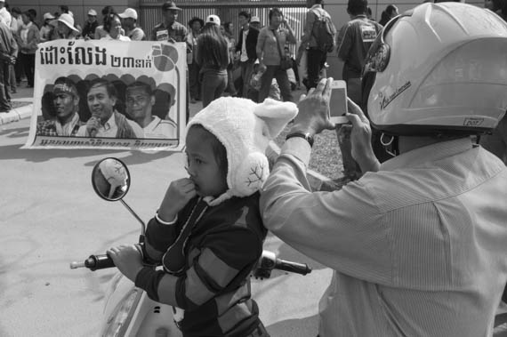 CAMBODIA. Phnom Penh. 23/01/2014: The Civil Society Organisation, on behalf of 181 NGO's, here in front of the Australian embassy, toured the embassies again to deliver a petition requesting the liberation of the 23 people jailed after the violent crackdown of striking workers on January 2nd and 3d, leaving behind 5 dead and numerous wounded.