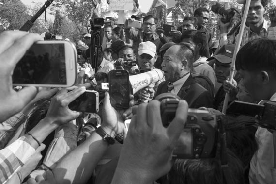 CAMBODIA. Phnom Penh. 27/01/2014: Mam Sonando, Director of Beehive Radio, addressing supporters who stage a protest march to the Ministry of Information to request a TV frequency.