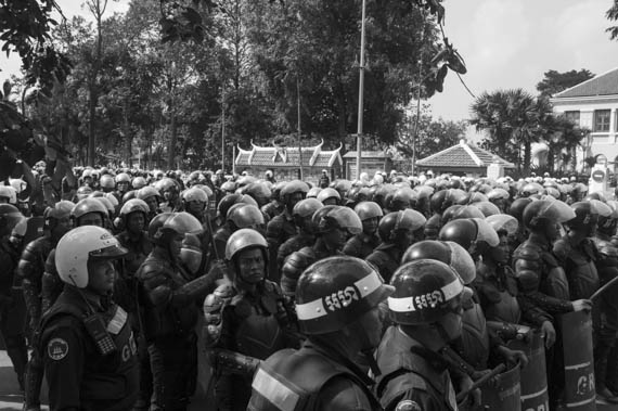 CAMBODIA. Phnom Penh. 27/01/2014: Members of the riot police and the gendarmerie ready to disperse supporters of Mam Sonando, director of Beehive Radio, who protest in front of the Ministry of Information to request a TV frequency.