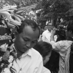 CAMBODIA. Phnom Penh. 22/01/2014: Sam Rainsy, CNRP co-President leading a march for the 10th commemoration of the assassination of union leader Chea Vichea, when a small crowd, led by Chea Mony, Union Leader and Chea Vichea's brother, Sam Rainsy and Kem Sokha, opposition CNRP Co-Presidents, marched from the FUTWC office to the statue of Chea Vichea.