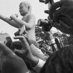 CAMBODIA. Phnom Penh. 22/01/2014: Press and 'political tourists' on the 10th commemoration of the assassination of union leader Chea Vichea, when a small crowd, led by Chea Mony, Union Leader and Chea Vichea's brother, Sam Rainsy and Kem Sokha, opposition CNRP Co-Presidents, marched from the FUTWC office to the statue of Chea Vichea.