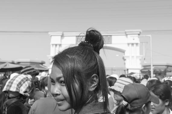 CAMBODIA. Dangkor (Phnom Penh). 28/01/2014: Workers waiting for their representatives to meet with the managers when about 1000 garment factory workers at the industrial area of Vattanac II walked out after 11 union leaders were fired.