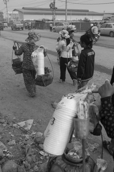 CAMBODIA. Phnom Penh. 01/02/2014: Street vendors catering to garment workers near the place where several striking workers were killed by army bullets during a violent crackdown on January 3rd.