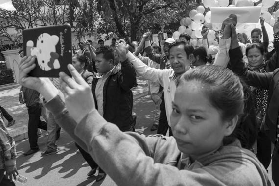 CAMBODIA. Phnom Penh. 10/02/2014: Rong Chhun, president of the Cambodian Independent Teachers Association ( CITA), and other union leaders leading a march of about 300 people towards Preah Ang Dong riverside pagoda. A whole series of simultaneous events were organised, both in Cambodia and in front of Cambodian embassies abroad, one day ahead of the appeal hearing to grant bail to 21 of the 23 people jailed during the violent crackdown by the army on striking workers this early january.