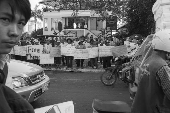 CAMBODIA. Phnom Penh. 11/02/2014: Workers and supporters demonstrate outside the Appeals Court where the judges decide on a request for bail for 21 workers, activists and union leaders arrested during the violent crackdown of a workers strike on January 2nd and 3rd.