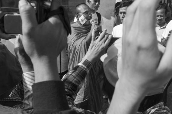 CAMBODIA. Phnom Penh. 11/02/2014: But Bunthen, Independent Monk Network for Social Justice (IMNSJ) leader, addresses workers and supporters demonstrating outside the Appeals Court where the judges decide on a request for bail for 21 workers, activists and union leaders arrested during the violent crackdown of a workers strike on January 2nd and 3rd.