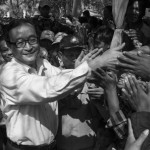 CAMBODIA. Sa'ang (Kandal). 26/02/2014: Sam Rainsy greeting the public at a meeting of about 600 supporters he and Kem Sokha, opposition CNRP co-Presidents, attend in Sa'ang district.