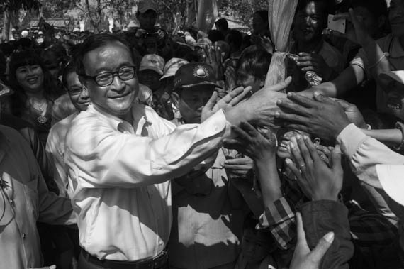 CAMBODIA. Sa'ang (Kandal). 26/02/2014: Sam Rainsy greeting the public at a meeting of about 600 supporters he and Kem Sokha, opposition CNRP co-Presidents, attend in Sa'ang district.