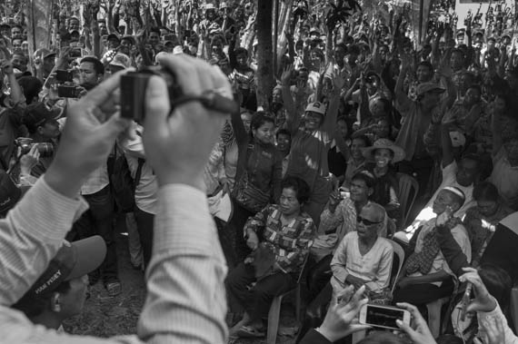 CAMBODIA. Sa'ang (Kandal). 26/02/2014: About 600 opposition CNRP supporters cheer Sam Rainsy and Kem Sokha, opposition CNRP co-Presidents, at an unhindered public meeting in Sa'ang district.