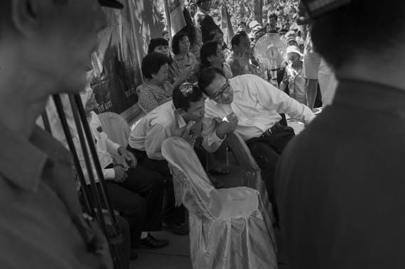 CAMBODIA. Sa'ang (Kandal). 26/02/2014: Sam Rainsy, opposition CNRP co-President, talks to a CNRP MP at an unhindered public meeting in Sa'ang district.