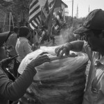 CAMBODIA. Phnom Penh. 3/02/2014: Corn on the cob seller at press conference organised by Boeung Kak lake representatives about the land issue they have since 2007, when a development company was granted a 99-year concession to Boeung Kak lake and evicted 3000 families in the process.