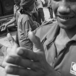 CAMBODIA. Phnom Penh. 4/02/2014: Striking workers of CINTRI, the company in charge of garbage collection for the city of Phnom Penh which faces a walkout by its truck drivers for a salary rise from $US75 to $US150, dance to the music of a hired sound system.