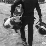 CAMBODIA. Phnom Penh. 5/02/2014: Municipal guard carrying protective helmets arriving on the site where negotiations are held with CINTRI workers, in charge of the garbage collection of Phnom Penh, on their third day of a strike about their wage of 75$US per month.