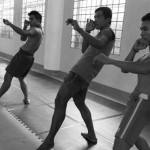 CAMBODIA. Phnom Penh. 20/02/2014: Manou Phuon, Choreographer, rehearsing a new piece inspired by khmer boxing with Amrita Performing Arts dancers, here coached by Him Saran, a professional boxer.