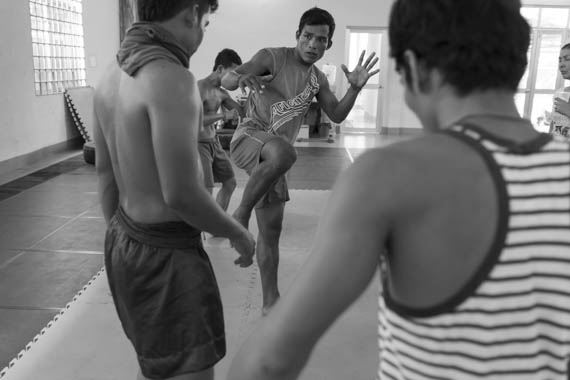 CAMBODIA. Phnom Penh. 20/02/2014: Manou Phuon, Choreographer, rehearsing a new piece inspired by khmer boxing with Amrita Performing Arts dancers, here coached by Him Saran, a professional boxer.