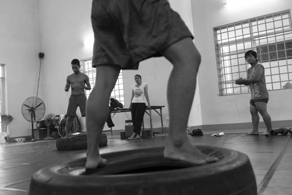 CAMBODIA. Phnom Penh. 20/02/2014: Manou Phuon, Choreographer, rehearsing a new piece inspired by khmer boxing with Amrita Performing Arts dancers.