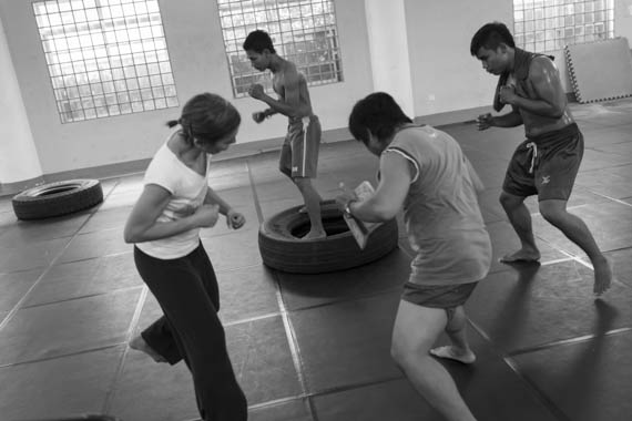 CAMBODIA. Phnom Penh. 20/02/2014: Manou Phuon, Choreographer, rehearsing a new piece inspired by khmer boxing with Amrita Performing Arts dancers.