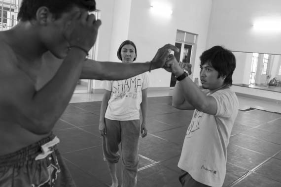 CAMBODIA. Phnom Penh. 21/02/2014: Rehearsals of a piece inspired by khmer boxing, choreographed by Manou Phuon with dancers from Amrita Performing Arts, here coached by Him Saran, a professional boxer.