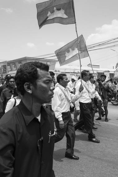 CAMBODIA. Phnom Penh 30/03/2014: Kem Sokha and Sam Rainsy, CNRP co-presidents, march to the party headquarters after the commemoration ceremony for the 1997 grenades attack on a political rallye of 200 Sam Rainsy Party supporters during which 16 people were killed and more than 100 wounded.