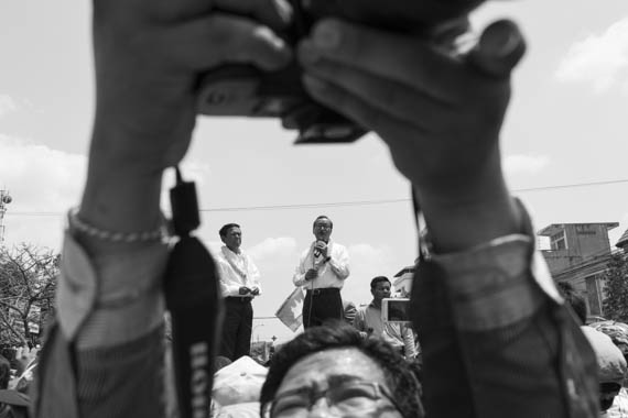 CAMBODIA. Phnom Penh 30/03/2014: Kem Sokha and Sam Rainsy, CNRP co-presidents, address CNRP supporters during an improvised congress after a march to the party headquarters following the commemoration ceremony for the 1997 grenades attack on a political rallye of 200 Sam Rainsy Party supporters during which 16 people were killed and more than 100 wounded.