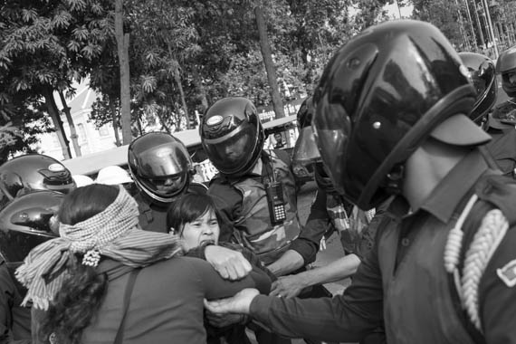 CAMBODIA. Phnom Penh 5/03/2014: Members from the former Boeung Kak Lake are arrested in front of City Hall while waiting for a group of land rights activists who plan to deliver an invitation to a ceremony for Women's Day.