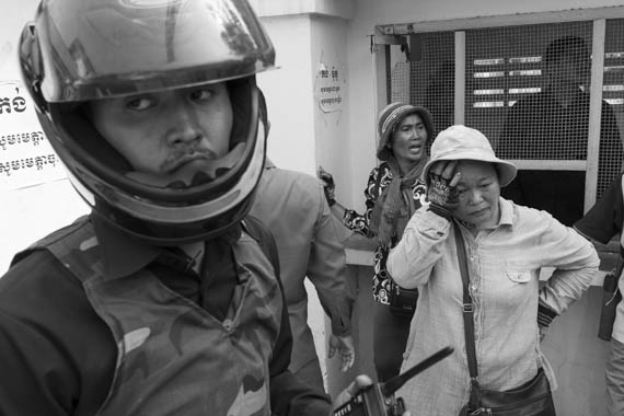 CAMBODIA. Phnom Penh 5/03/2014: Boeung Kak Lake activists trying to deliver an invitation to a ceremony for International Women's Day to the Daun Penh police station.