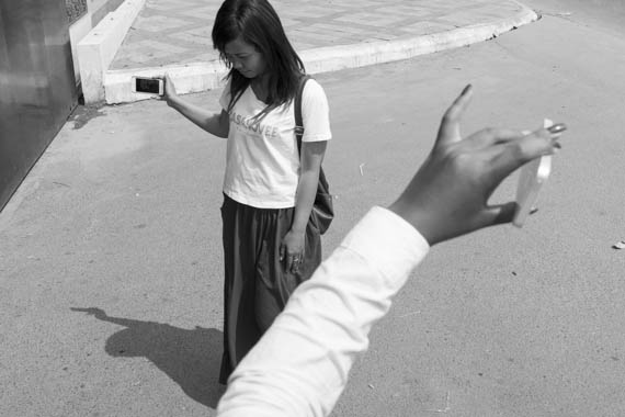 CAMBODIA. Phnom Penh 5/03/2014: Social media ciizen journalists filming the Boeung Kak Lake trying to deliver an invitation to a ceremony for International Women's Day at the CPP headquarters.