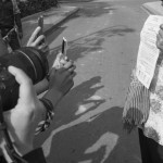 CAMBODIA. Phnom Penh. 6/03/2014: Journalists photograph a document held by a woman from the Boeung Kak lake community who demonstrated and was arrested the day before, requesting a meeting about a retroactive compensation for their eviction with City Hall officials again