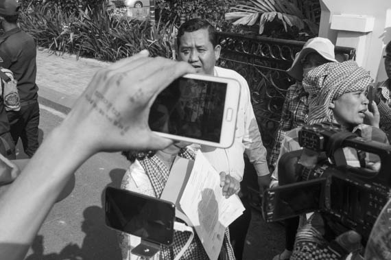 CAMBODIA. Phnom Penh. 6/03/2014: Official from City Hall meeting with women from the Boeung Kak lake community who demonstrated and were arrested the day before and who request a meeting about a retroactive compensation for their eviction.