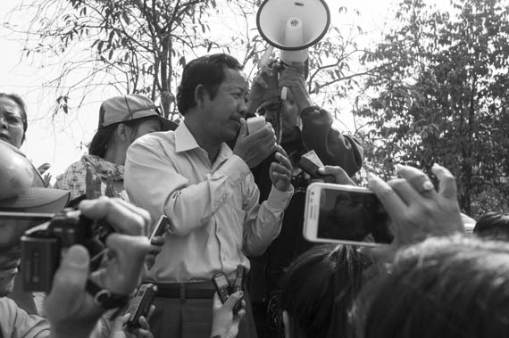 CAMBODIA. Phnom Penh. 8/03/2014: Rong Chhun, president of the Cambodian Independent Teachers Association ( CITA), addresses the crowd when authorities prevent a public forum organised by labour unions to be held at Freedom Park on International Women's Day.