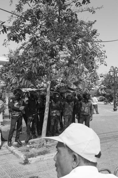 CAMBODIA. Phnom Penh. 8/03/2014: Municipal security guards block access to Freedom Park to prevent a public forum organised by labour unions to be held on International Women's Day.