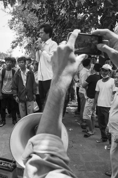 CAMBODIA. Phnom Penh. 8/03/2014: Tim Malay, Activist and Union Leader from IDEA addresses the crowd during an alternative public forum as authorities prevented such an event organised by labour unions to be held at Freedom Park on International Women's Day.