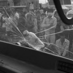 CAMBODIA. Phnom Penh.02/01/2014: Workers at the Yakjin factory who were dispersed in the morning by members of Unit 911 from the RCAF organise a roadblock on Road Nr 4. Voan Pov, Union Leader, and three monks were beaten and arrested earlier during the protest.