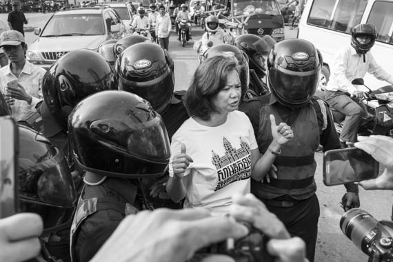 CAMBODIA. Phnom Penh 2/04/2014: Mu Sochua, CNRP lawmaker, is pushed out of 'Freedom Place' by municipal security guards.