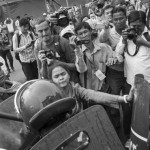 CAMBODIA. Phnom Penh 4/04/2014: Supporters of Vorn Pov, union leader jailed during the early january crackdown by the army of a worker's strike, scuffle with riot police during a demonstration at the municipal court during a bail request hearing.