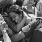 CAMBODIA, Phnom Penh. 30/05/2014: Overjoyed supporters on the 6th day of the trial of 23 workers, union leaders and activists who were arrested during a violent military crackdown of a strike in early January, when learning all the accused were found guilty but with suspended sentences.