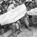 CAMBODIA, Phnom Penh. 6/06/2014: On the 3rd day of a strike at Ocean garment factory, owned by Bangladeshi capital, the workers hold a demonstration in front of the Ministry of Labour to demand half their salary instead of the 15$ they get for a period of suspended orders.