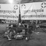 CAMBODIA, Poipet (Banteay Meanchey). 17/06/2014: Migrant worker having crossed the border the previous day and having missed transportation to their home province spent the night in a shelter provided by the authorities. In a massive movement of fear, some 180.000 cambodian migrant workers, many of them illegal, return home in one week time after the military coup in Thailand which vowed to normalise the situation of illegal immigration.