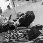 CAMBODIA, Phnom Penh. 1/07/2014: Visitors testing massage chairs on the first official opening day of the Aeon mall, a 205 million dollar investment by a Japanese microfinance company.